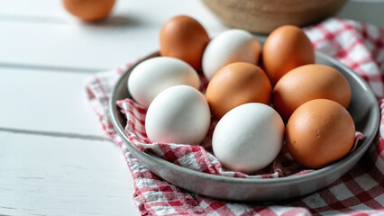 Charming Collection of White and Brown Chicken Eggs in Rustic Plate for Organic Food Marketing and Culinary Use