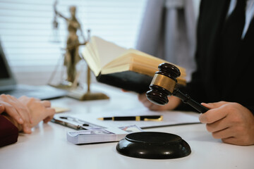 Professional lawyers consult with clients in the office on legal agreements, contracts and financial matters to ensure fairness and compliance with the law.