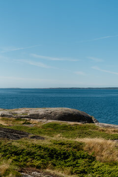 Scenic summer coastal landscape with granite rocks and blue sea in Frilles&aring;s, Halland, Sweden