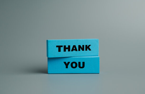 Symbol with word thank you, Wooden block and text on gray background, Positive communication, Business and thank you concept. copy space	