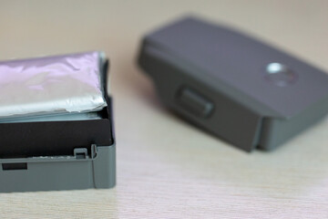 Disassembled drone battery, swollen battery, repair and maintenance of Li-ion power supply for quadrocopter