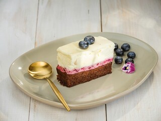 Delicious cakes from the communist era in Romania, such as eclairs and fruit tarts, beautifully presented on elegant plates invite sweet reminiscence of a bygone culinary tradition