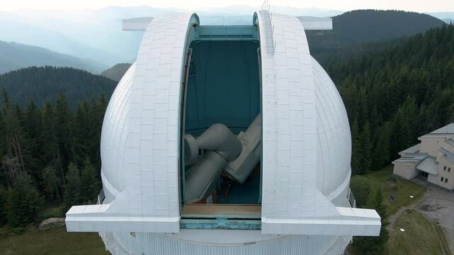 Among the forested hills and mountains, the Rozhen Observatory is located. An observation point for astronomers and scientists. Aerial view