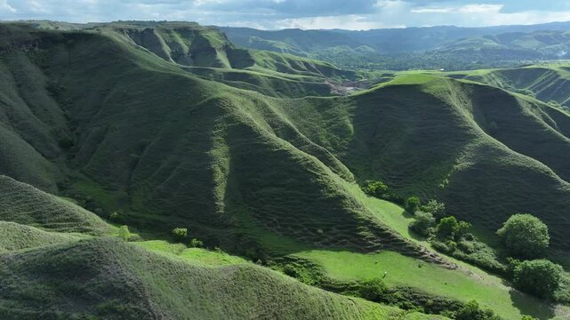 Aerial view of green hill Bukit Tanau, Sumba, Indonesia. Nature landscape background.