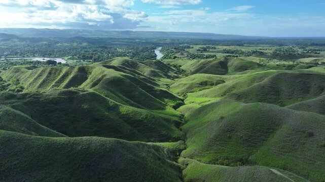 Aerial view of green hill Bukit Tanau, Sumba, Indonesia. Nature landscape background.