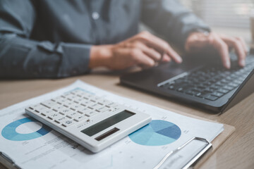 Accountant used a calculator financial analysis managing payroll tax accounting budget accounts.