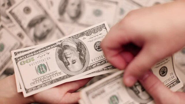 counts the money and hands it over