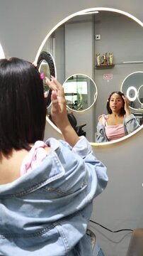 Latina girl happily wearing makeup