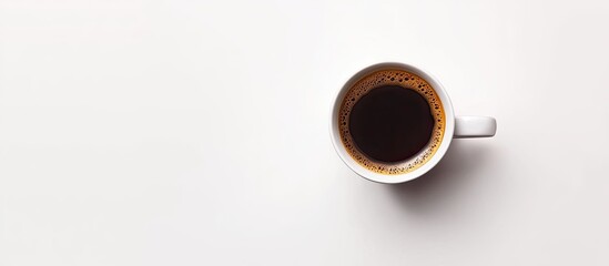 Black coffee in a white mug positioned slightly left on a bright white background creating ample copyspace for text or branding.