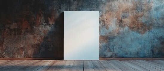 Blank white poster on grunge concrete wall with wooden floor mockup showcasing empty space for design elements in a contemporary setting