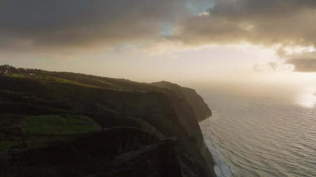 Aerial drone epic sunset golden coastline at Ponta do Pargo in Madeira island, Portugal