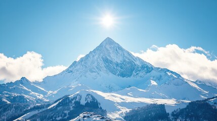 Fototapeta premium A snow-capped mountain peak under a bright sun, showcasing natural beauty and tranquility.