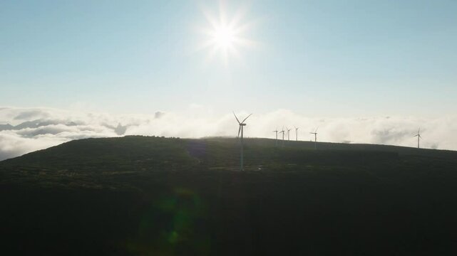 Aerial drone shot of wind mills on Madeira, renewable green energy generating electricity