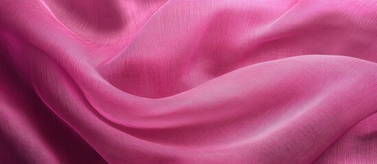 Obraz premium Soft pink textile fabric texture with gentle folds creating a smooth abstract surface background featuring vintage hues for stylish design projects.