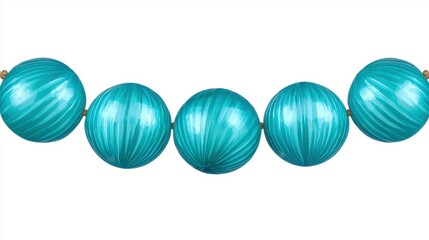 A striking row of turquoise colored glass beads glimmering in light creating an eye-catching decorative display