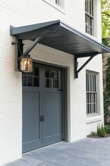 Obraz premium Elegant entrance featuring a gray double door and vintage lantern, enhancing the charm of the white brick building in a peaceful suburban setting