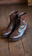  Vintage Leather Boots with Polished Brown Finish on Wooden Floor in Rustic Setting