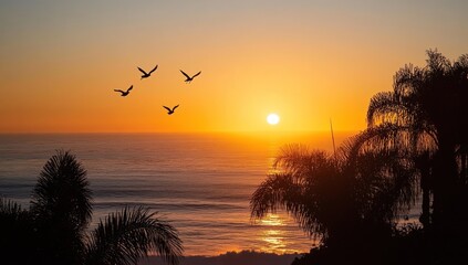 Naklejka premium Sunset birds silhouettes over ocean palm trees