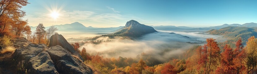 Obraz premium Panoramic Mountain Landscape with Foggy Valley, Autumn Foliage, and Sunrise Scenery