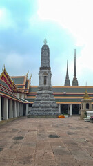 Fototapeta premium Bangkok,Thailand - January 30, 2024: View of Wat phra kaew buddhist temples complex on the grounds of the Grand Palace,Hor Phra Monthian Dharma, The Temple of the Emerald Buddha,Phra Asada Maha Chedi