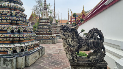Sandstone doll at Wat Pho that is a Buddhist temple complex Chinese and Thai style in Bangkok,...