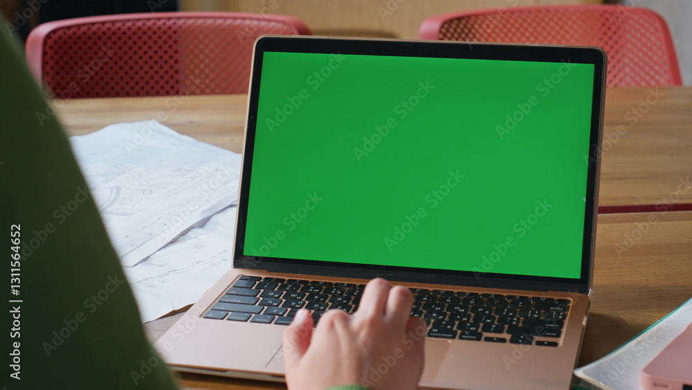 Poster employee using greenscreen touchpad on computer at remote workplace closeup