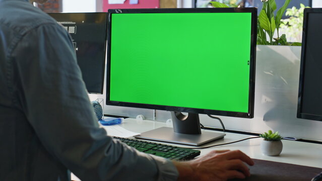 Office guy using chromakey computer closeup. Worker hand holding mouse device