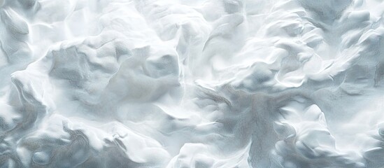 Obraz premium Soft textured light gray foam surface backdrop with subtle shadows and gentle curves creating an ethereal, calming atmosphere.