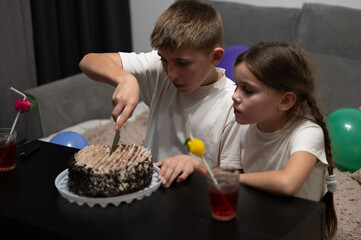 Celebrating moments with friends as children enjoy cake and laughter during a festive gathering in...