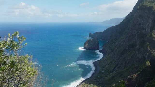 Epic aerial drone shot of coastline with steep cliffs of Madeira, Portugal