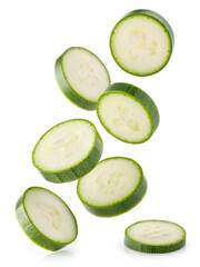 Floating zucchini slices on white background, fresh vegetable concept