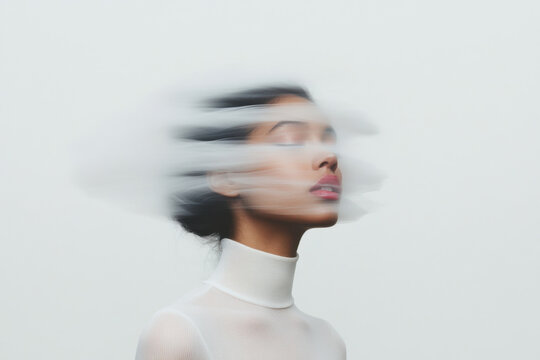 Woman feeling dizzy with blurred face and closed eyes