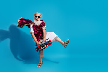 Photo of crazy cheerful theater actor perform modern art hold radio music isolated on blue color background