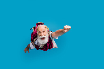 Photo of funky funny man ancient god mythological character wear costume isolated on blue color...