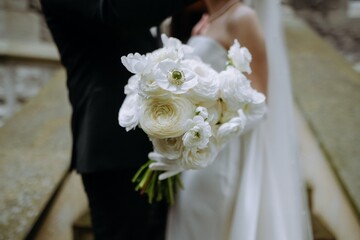 Elegant Bridal Bouquet of White Flowers in Romantic Setting