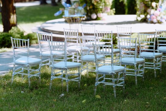 Elegant Clear Chiavari Chairs Set Up for Outdoor Event Ceremony