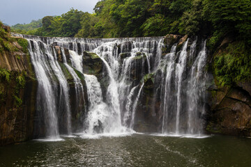 Fototapeta premium Shifen Waterfall - Famous nature landscape of Taiwan, shot in Pingxi District, New Taipei, Taiwan.