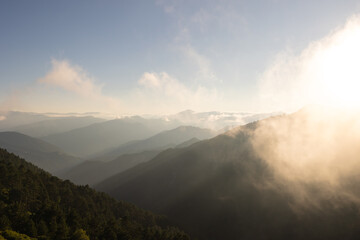 Mountain range with haze at sunset.