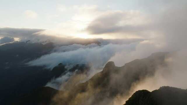 Epic clouds and sunrise over the mountains of Madeira, from Bica da Cana, aerial drone