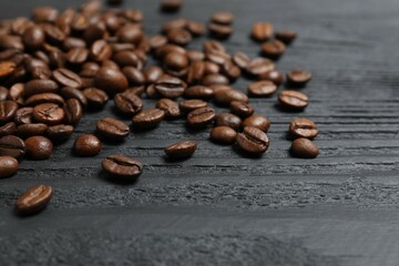 Ffresh coffee beans in a bowl on wooden background