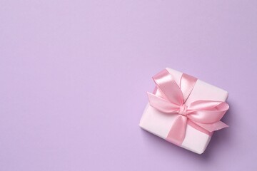 Beautiful gift box on color background