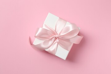 Beautiful gift box on color background