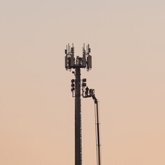 Close up of a isolated telecommunication tower with cellular antennas for 4G and 5G connection. Cellular antenna repeater tower. technician repairing fault