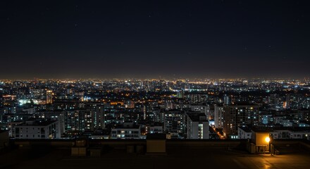 Night cityscape with bright city lights and starry sky over urban buildings