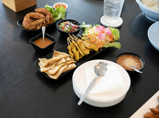 Pork Satay in bowl on black wooden table background