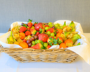 Basket of fresh fruits on a table for a healthy power break