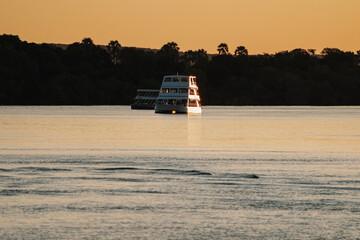 Tourists enjoying a sunset cruise on the Zambezi River in Zimbabwe