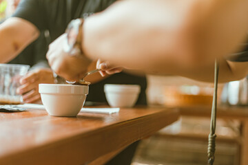 Barista preparing to test and inspecting the quality of coffee