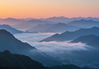 Fototapeta premium Majestic mountain layers at sunrise with serene foggy valleys and vibrant horizon
