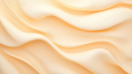 A soft, flowing fabric in warm cream tones, creating an elegant and smooth texture with gentle waves.